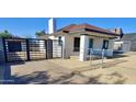 Front view of the house with a new gate at 2112 N 24Th Pl, Phoenix, AZ 85008