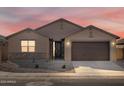 New single-story home with a two-car garage and desert landscaping at 2639 E Santa Ynez Dr, Casa Grande, AZ 85194