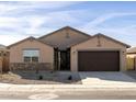 New construction home with a two-car garage and stone accents at 2639 E Santa Ynez Dr, Casa Grande, AZ 85194