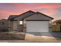 Gray exterior, two-car garage, landscaping, and stone accents at 2665 E Santa Ynez Dr, Casa Grande, AZ 85194