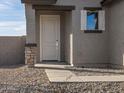 Light gray front door with sidelight and stone accents at 2665 E Santa Ynez Dr, Casa Grande, AZ 85194