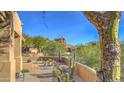 Landscaped front yard with desert plants and mountain backdrop at 7479 E Sunset Sky Cir, Scottsdale, AZ 85266