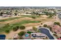 Home boasts a private pool, landscaped yard & golf views at 1950 N 142Nd Ave, Goodyear, AZ 85395