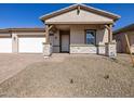 Charming single-story home with a two-car garage and desert landscaping at 17666 W Pierson St, Goodyear, AZ 85395