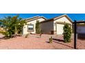 Cute curb appeal with a two-car garage and well-manicured yard at 22538 W Mohave St, Buckeye, AZ 85326