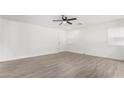 Bright and airy living room with wood-look flooring at 22538 W Mohave St, Buckeye, AZ 85326