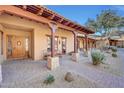 Spanish style home with covered entry and manicured landscaping at 27440 N Alma School Pkwy # 101, Scottsdale, AZ 85262