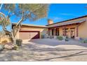 Attached two-car garage with a long driveway at 27440 N Alma School Pkwy # 101, Scottsdale, AZ 85262