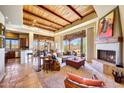 Open floor plan living area with fireplace and high ceilings at 27440 N Alma School Pkwy # 101, Scottsdale, AZ 85262