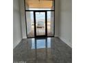 Bright entryway with modern flooring and glass doors at 40564 N 50Th St, Cave Creek, AZ 85331