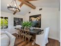 Bright dining area with a rustic table and modern chandelier at 6030 E Calle Del Sud St, Scottsdale, AZ 85251