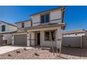 Two-story house with gray garage door and small front yard at 31730 N Waddle Ln, San Tan Valley, AZ 85143