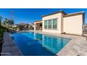 Relaxing rectangular pool in a backyard oasis at 97 E Alcatara Ave, San Tan Valley, AZ 85140