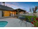 Home's backyard oasis features a sparkling pool, patio cover, and seating area at 1337 N Rosemont --, Mesa, AZ 85205