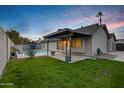 Stunning backyard view at dusk featuring a private pool and patio area at 1337 N Rosemont --, Mesa, AZ 85205