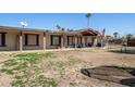 Expansive backyard with a covered porch, offering ample space for outdoor activities and entertaining at 3740 E Edna Ave, Phoenix, AZ 85032