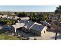 Single-story house with a large yard and detached garage at 3835 E Leland St, Mesa, AZ 85215