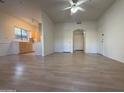 Open living room with wood-look floors and kitchen access at 9600 N 96Th St # 115, Scottsdale, AZ 85258