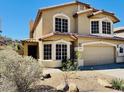Charming two-story home with desert landscaping, a tile roof, and a two-car garage at 20436 N 17Th Pl, Phoenix, AZ 85024