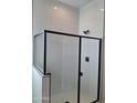 Bathroom featuring a walk-in shower with sleek black hardware and white subway tile at 27969 N 176Th Ave, Surprise, AZ 85387