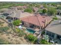 Backyard oasis with pool, spa, and patio, in a luxury community at 34704 N 93Rd Pl, Scottsdale, AZ 85262