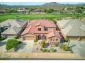 Luxury home with tile roof, situated on a golf course community at 34704 N 93Rd Pl, Scottsdale, AZ 85262