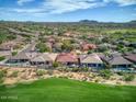 Community overview showcasing numerous homes and a golf course at 34704 N 93Rd Pl, Scottsdale, AZ 85262