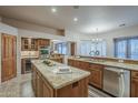 Gourmet kitchen featuring granite countertops, stainless steel appliances, and a large island at 37615 N Tranquil Trl, Carefree, AZ 85377