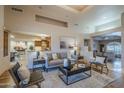 Open-concept living room, showcasing a seamless flow into the gourmet kitchen at 37615 N Tranquil Trl, Carefree, AZ 85377