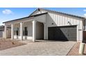 Charming home featuring a two-car garage and a well-paved driveway, adding to its curb appeal at 42140 N Golden Trl, San Tan Valley, AZ 85140