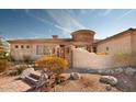 Spanish style home with courtyard entry and desert landscaping at 11461 S Wilson Ln, Goodyear, AZ 85338