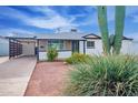 Bright white single story home with modern carport and desert landscaping at 1721 S Shafer Dr, Tempe, AZ 85281