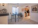 View of kitchen and dining area with breakfast bar at 7625 E Camelback Rd # B116, Scottsdale, AZ 85251