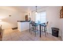 Bright dining area with a small table and three barstools at 7625 E Camelback Rd # B116, Scottsdale, AZ 85251