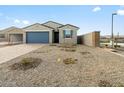 Lovely home with a brick paved driveway and a blue garage door, complemented by fresh landscaping at 8637 W Warner St, Tolleson, AZ 85353