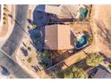 House with pool and backyard, aerial view showcasing neighborhood context at 22821 S 212Th St, Queen Creek, AZ 85142