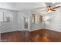 Living room with hardwood floors, sliding door to patio, and floor lamp at 3302 N 7Th St # 226, Phoenix, AZ 85014