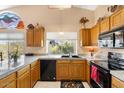 Well-equipped kitchen featuring wood cabinets and granite counters at 7943 E Aloe Cir, Gold Canyon, AZ 85118