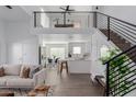 Open concept living area with loft, modern kitchen, and stylish furnishings at 3500 N Hayden Rd # 1902, Scottsdale, AZ 85251