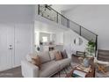 Spacious living area with a loft, modern finishes, and comfortable seating at 3500 N Hayden Rd # 1902, Scottsdale, AZ 85251