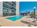 Community pool with lounge chairs and cabanas at 805 N 4Th Ave # 609, Phoenix, AZ 85003