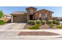 Inviting single-Gathering home boasting a brick exterior, a two-car garage, and manicured landscaping at 2837 W Minton St, Phoenix, AZ 85041