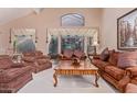 Spacious living room with ample seating, a large coffee table, and high ceilings at 8062 E Cortez Dr, Scottsdale, AZ 85260