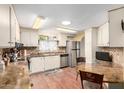 Bright kitchen features stainless steel appliances and ample counter space at 5502 E Baywood Ave, Mesa, AZ 85206