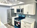 Modern kitchen features stainless steel appliances and updated countertops at 1230 N 84Th Pl, Scottsdale, AZ 85257