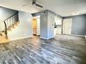 Spacious living room with wood-look tile floors and open concept at 1230 N 84Th Pl, Scottsdale, AZ 85257