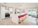 Modern kitchen featuring a large island, stainless steel appliances, and white cabinetry at 602 E Taylor St, Tempe, AZ 85288
