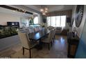 Elegant dining room, featuring a large table, and natural light at 7214 E Royal Palm Rd, Scottsdale, AZ 85258