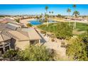 Landscaped backyard oasis with a water fountain and golf course views at 9048 E Cedar Waxwing Dr, Sun Lakes, AZ 85248