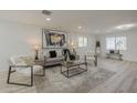 Bright living room with modern furnishings and contemporary artwork at 1323 W Tuckey Ln, Phoenix, AZ 85013